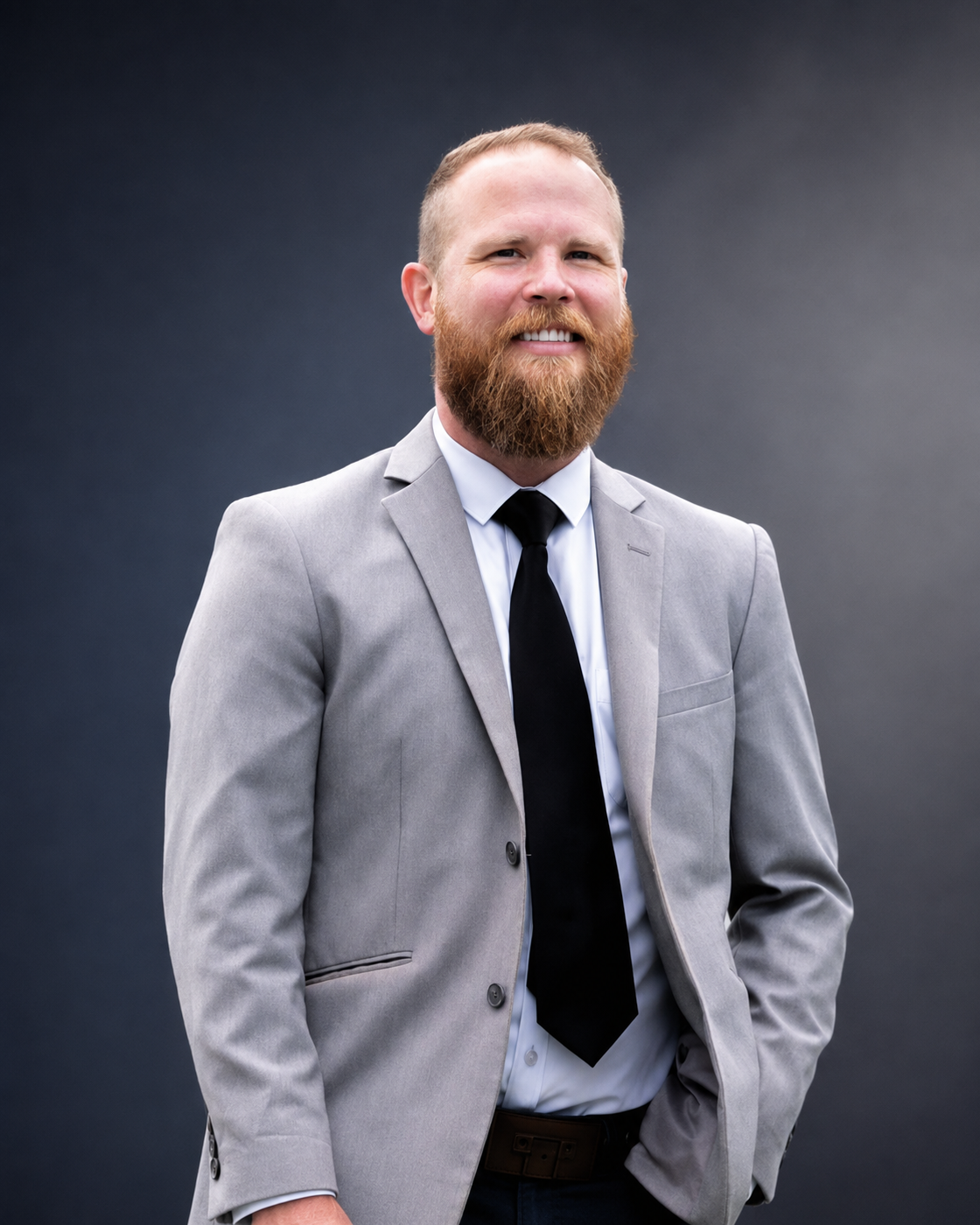 Martin Tippet in a gray suit